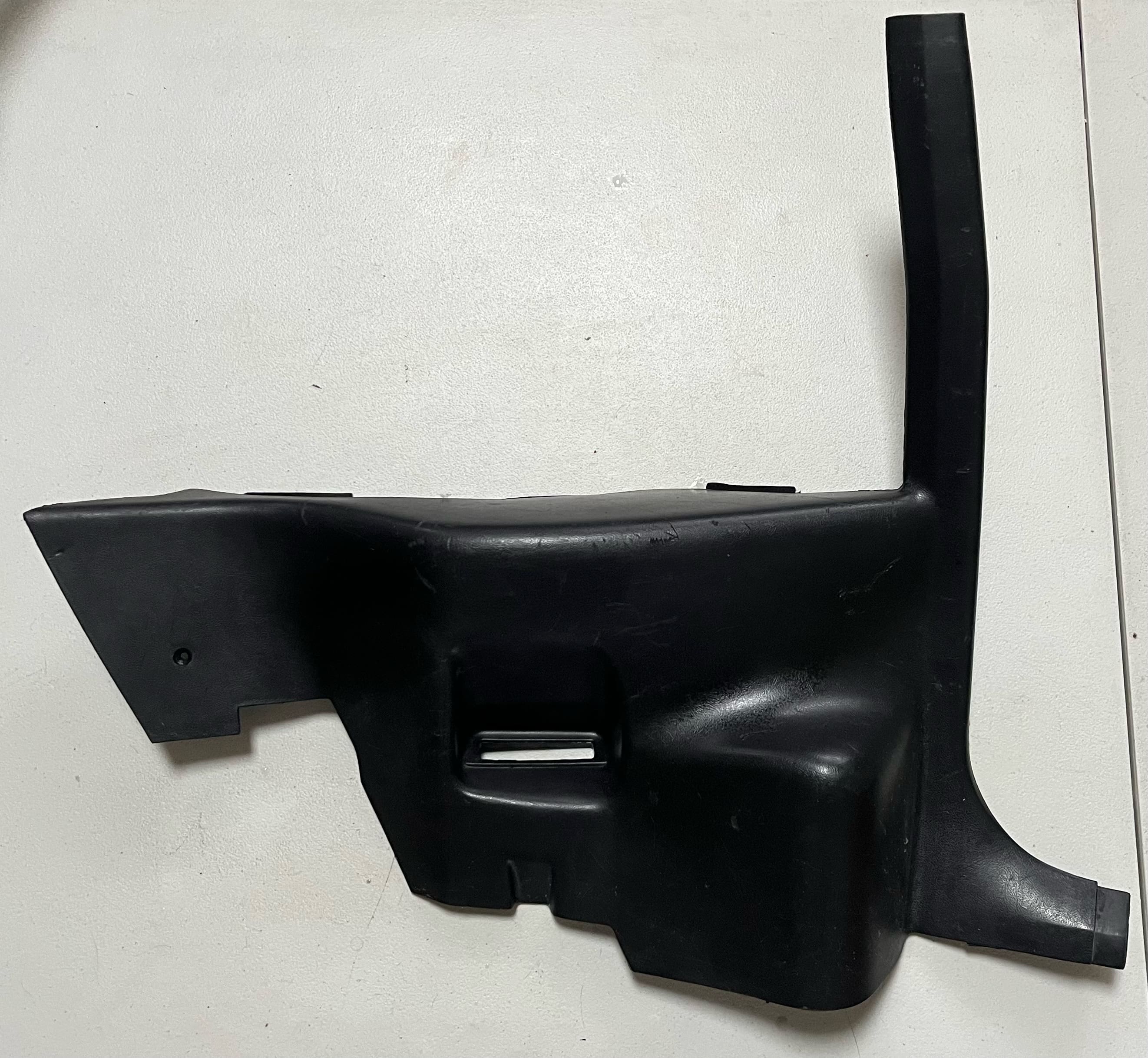 82-88 Camaro/Firebird black rear lower interior trim piece (Driver)