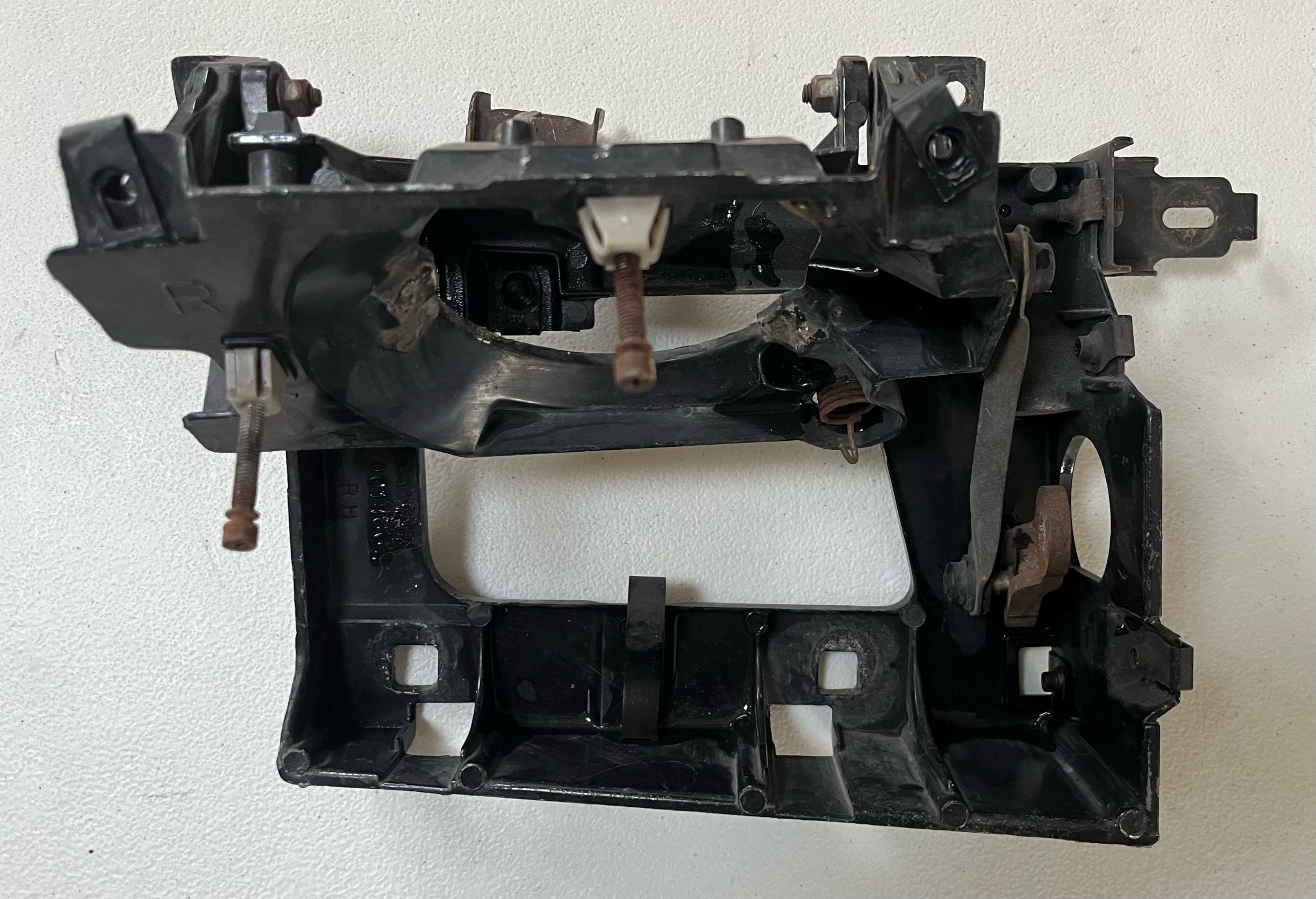 91-92 Firebird passenger headlight bracket